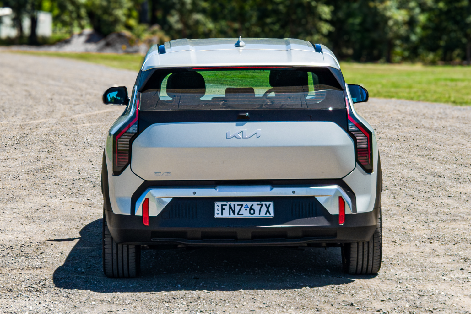 Close straight-on rear view of the 2026 Kia EV3 Earth Long Range with EV3 badge