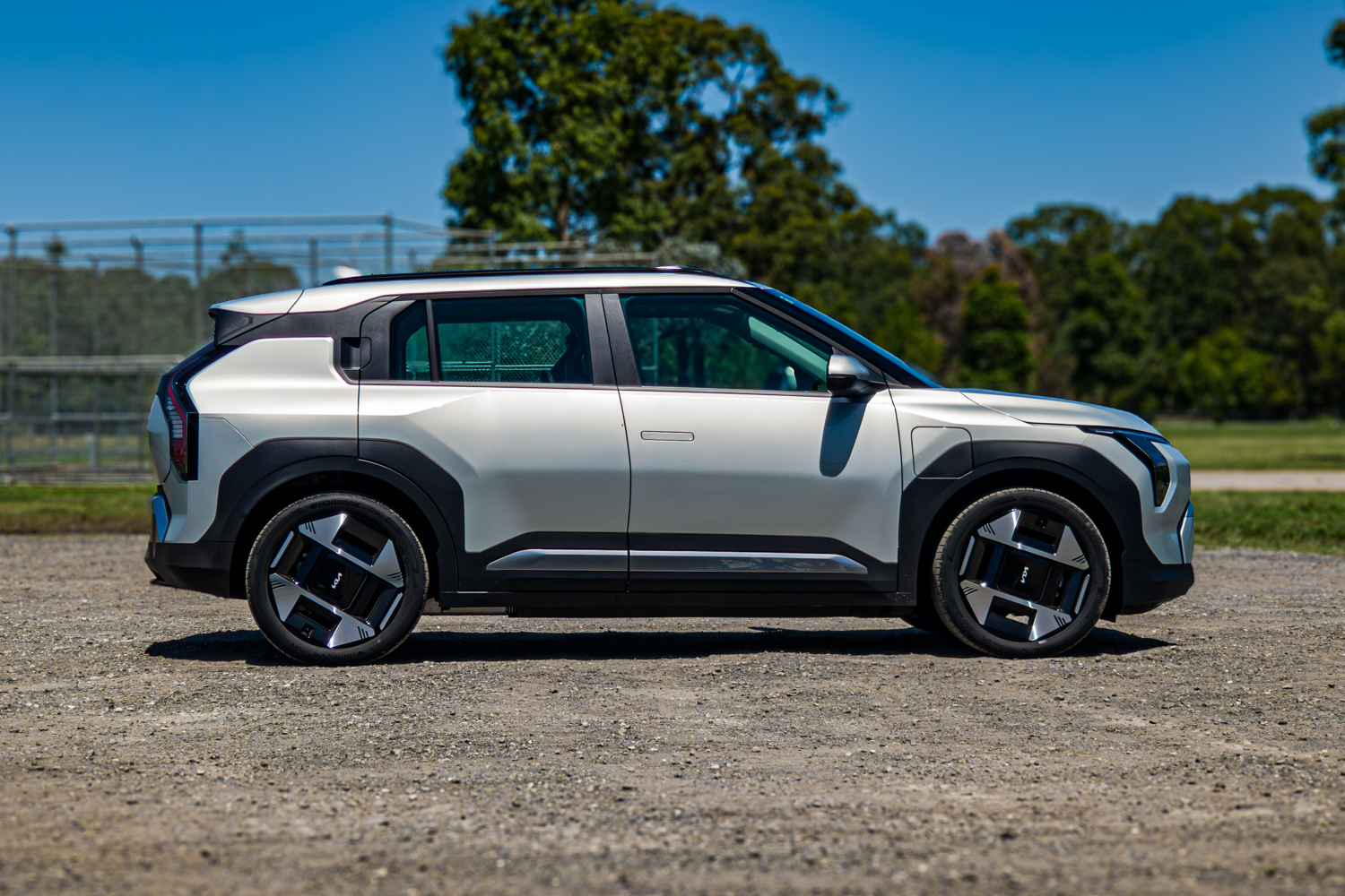 Driver's-side profile of the silver 2026 Kia EV3 Earth Long Range electric SUV