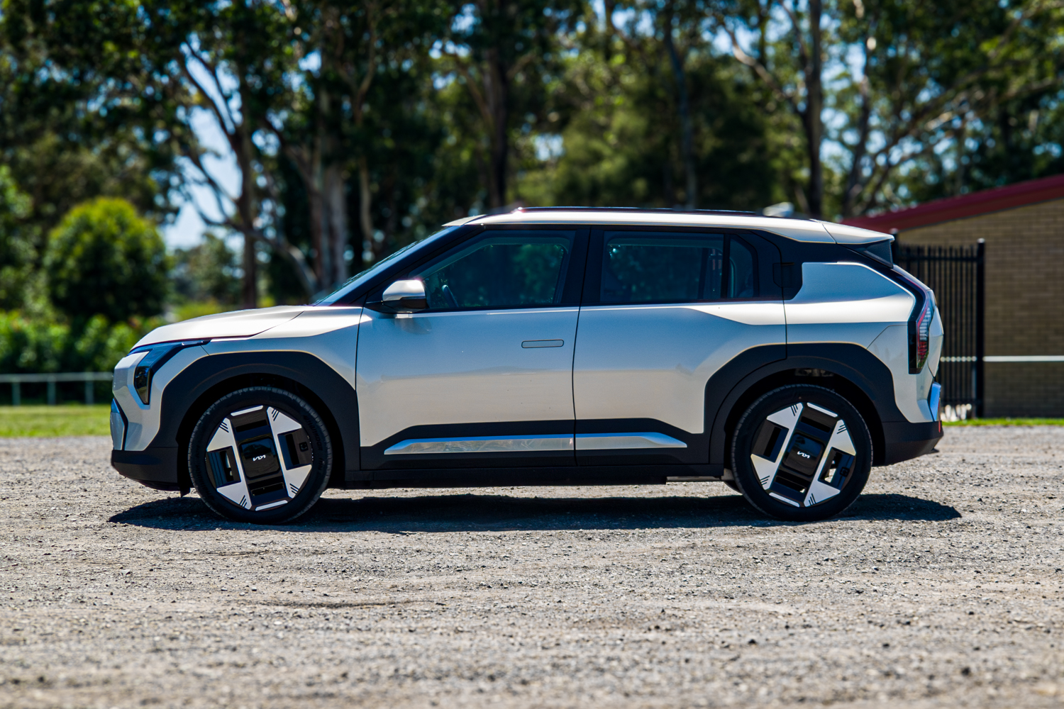 Passenger's-side profile of the silver 2026 Kia EV3 Earth Long Range electric SUV