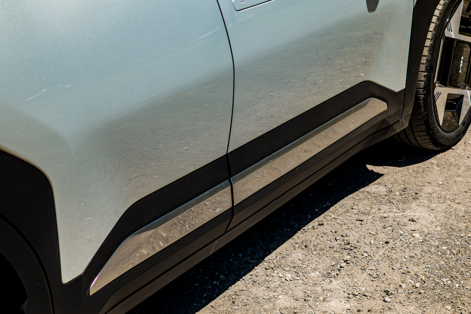 Close-up of the lower door and side-sill trim on the silver 2026 Kia EV3 Earth Long Range
