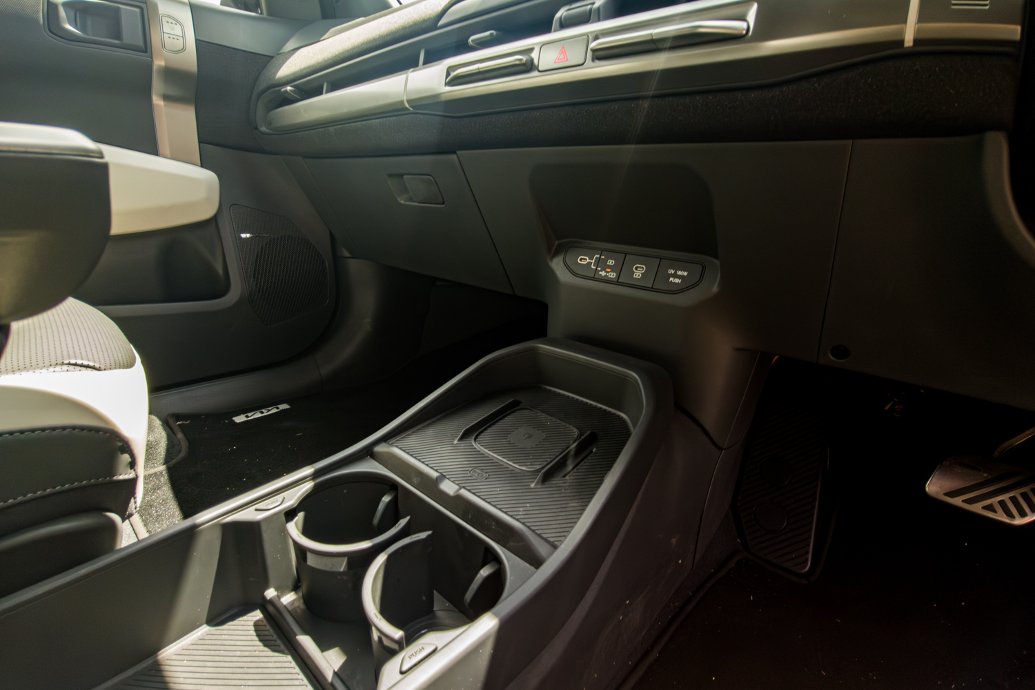 Centre console of the 2026 Kia EV3 GT-Line with wireless charging pad and USB ports