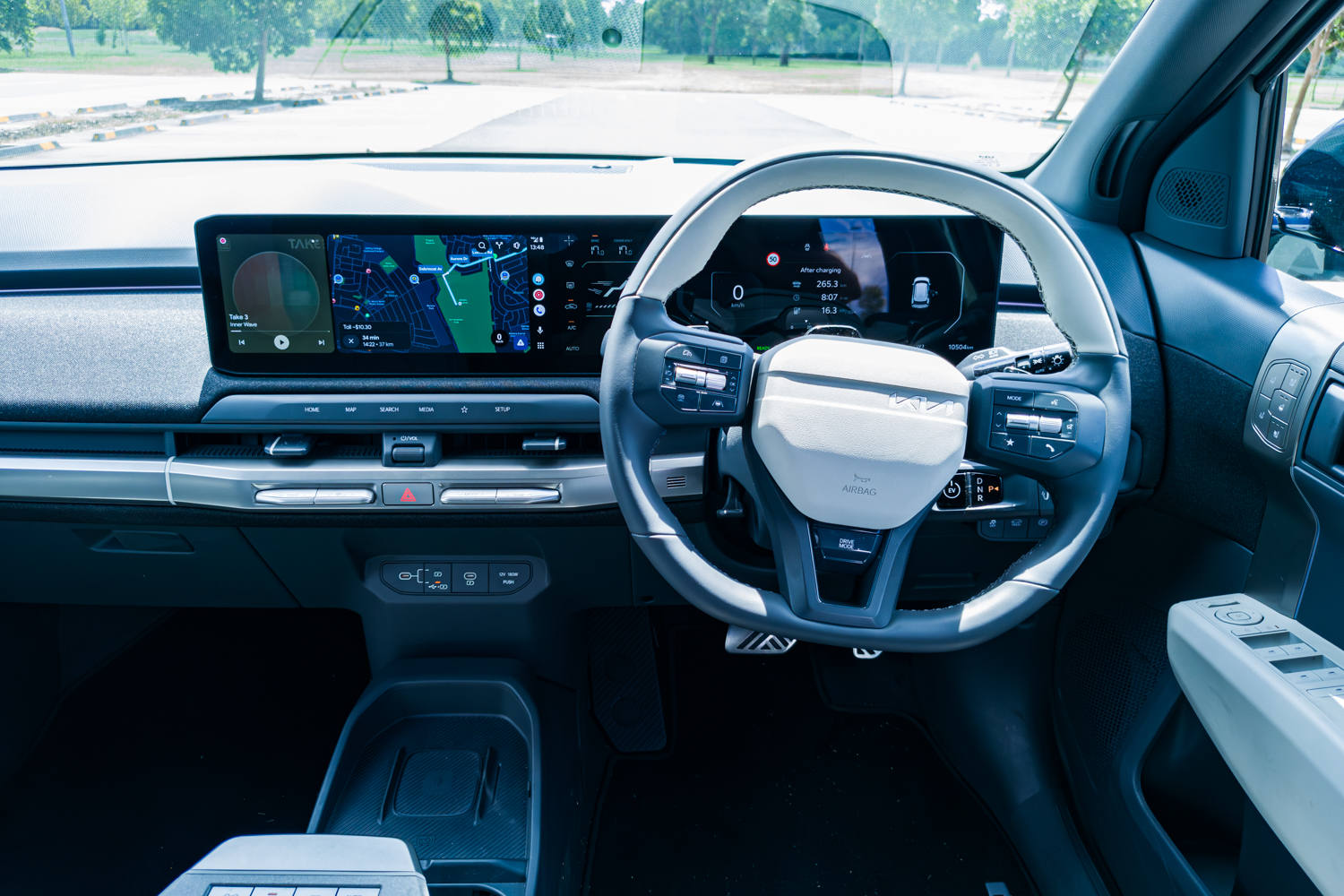 Driver cockpit overview of the 2026 Kia EV3 GT-Line showing dual-screen layout