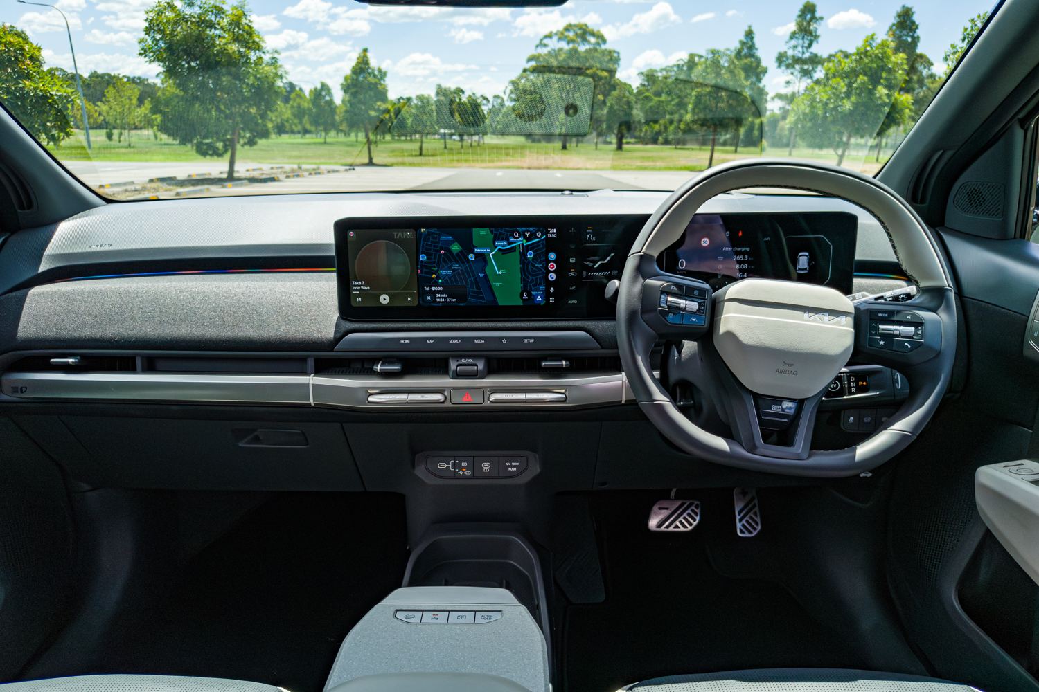 Dashboard of the 2026 Kia EV3 GT-Line showing widescreen display with navigation map