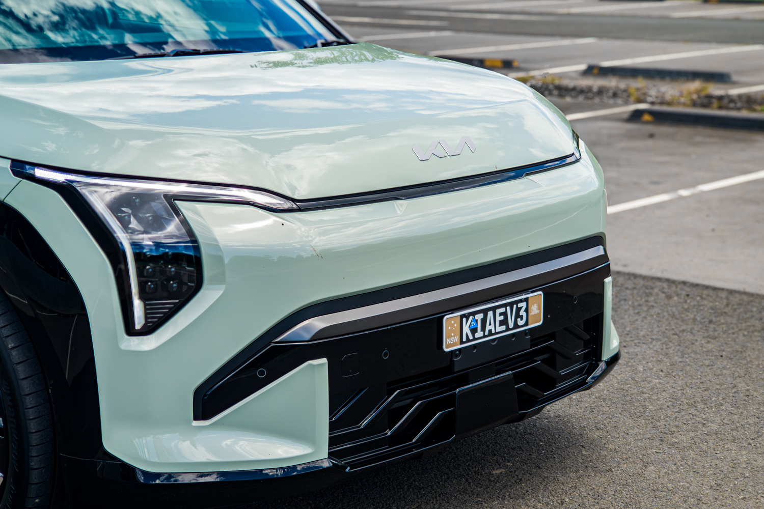 Close front view of the 2026 Kia EV3 GT-Line showing full-width LED light bar