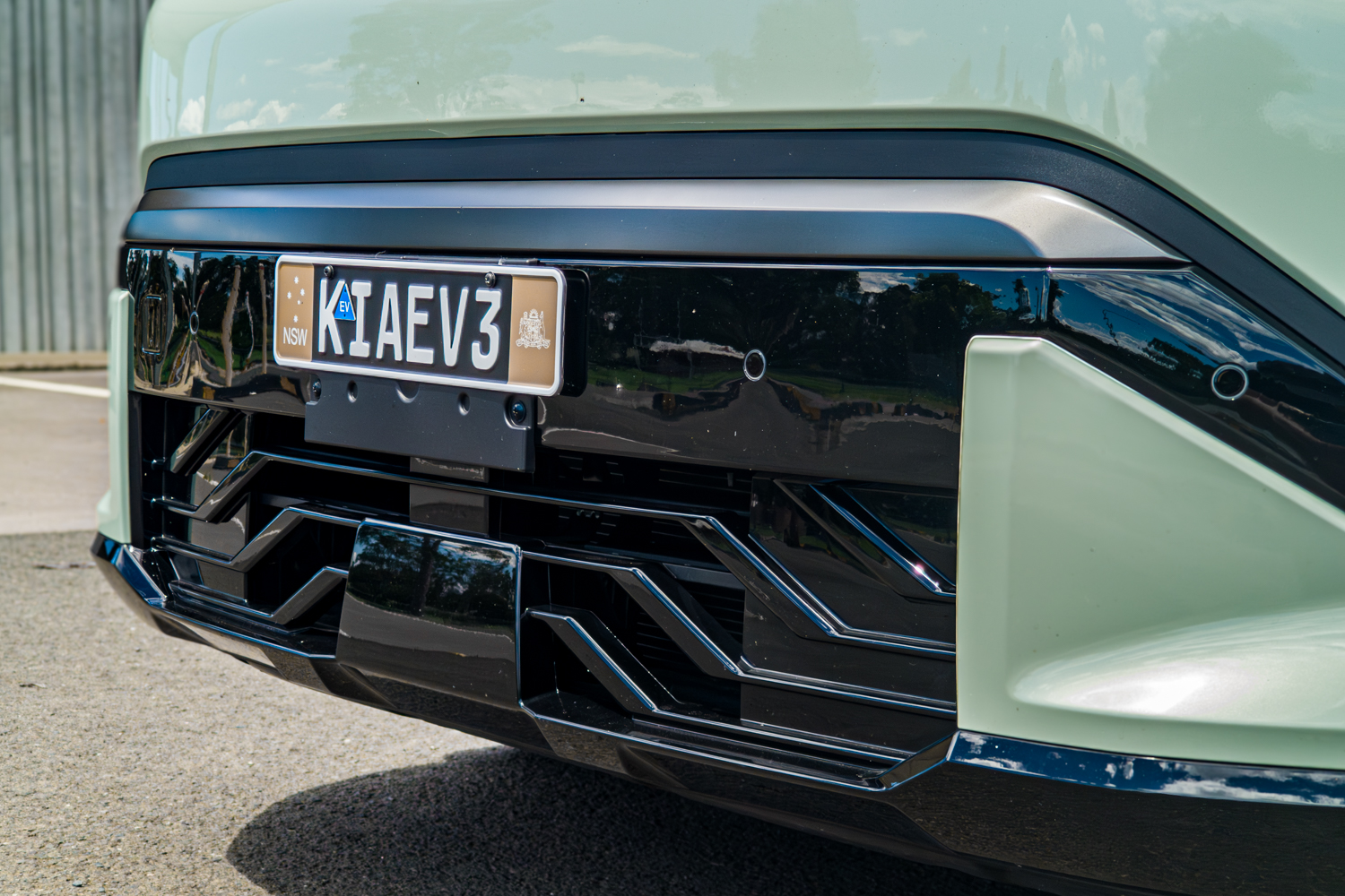 Lower front bumper of the 2026 Kia EV3 GT-Line with geometric closed grille insert
