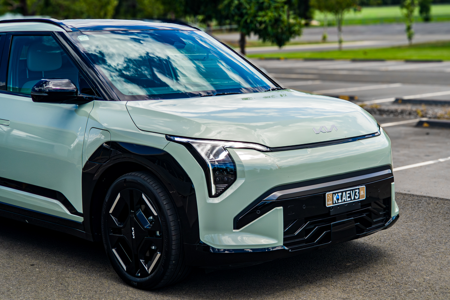 Front right three-quarter view of the 2026 Kia EV3 GT-Line in a parking lot