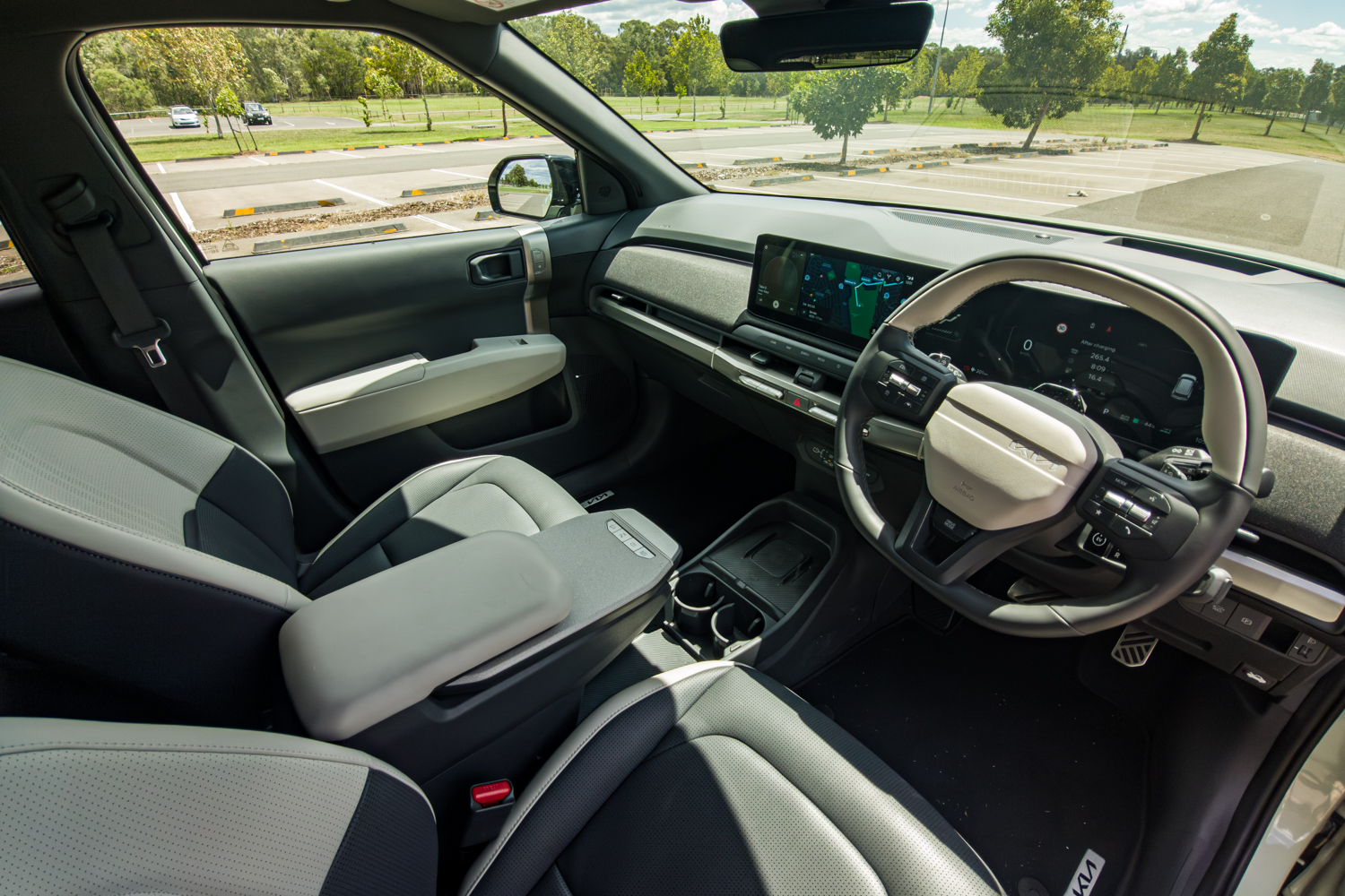 Interior of the 2026 Kia EV3 GT-Line showing panoramic sunroof and front cabin