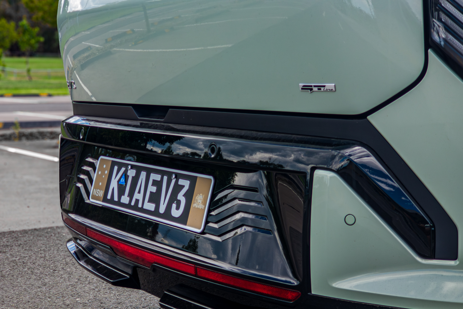 Close-up of the 2026 Kia EV3 GT-Line rear bumper showing the GT-Line badge