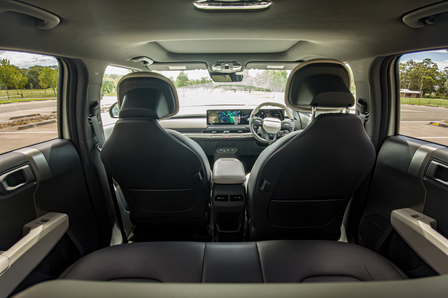 Interior rear view of the 2026 Kia EV3 GT-Line looking forward through the cabin