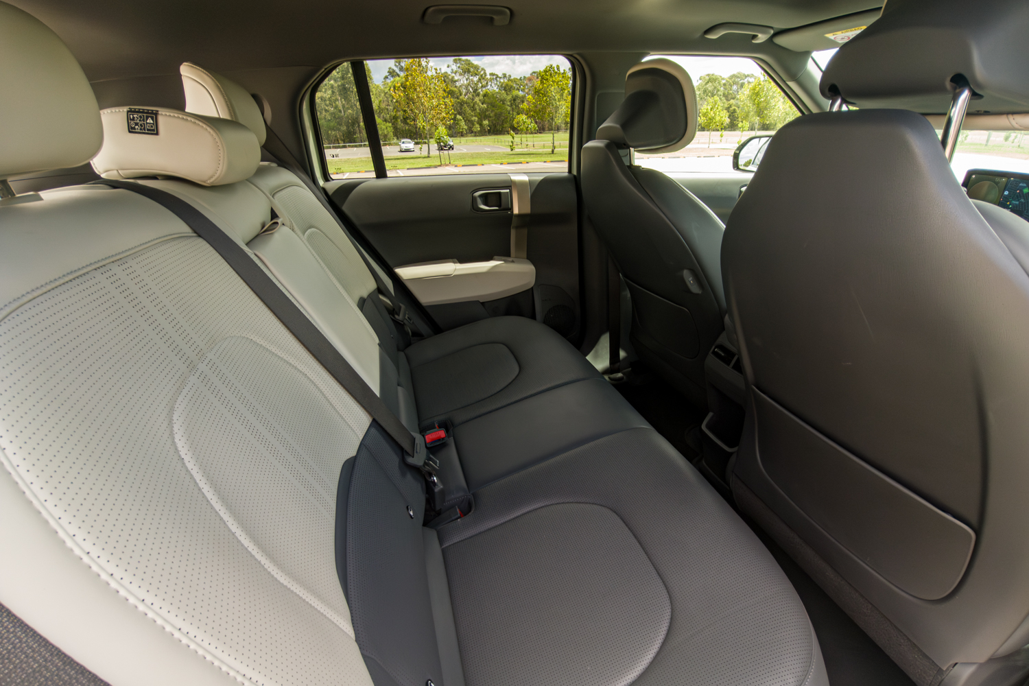 Rear seat of the 2026 Kia EV3 GT-Line showing two-tone perforated synthetic leather