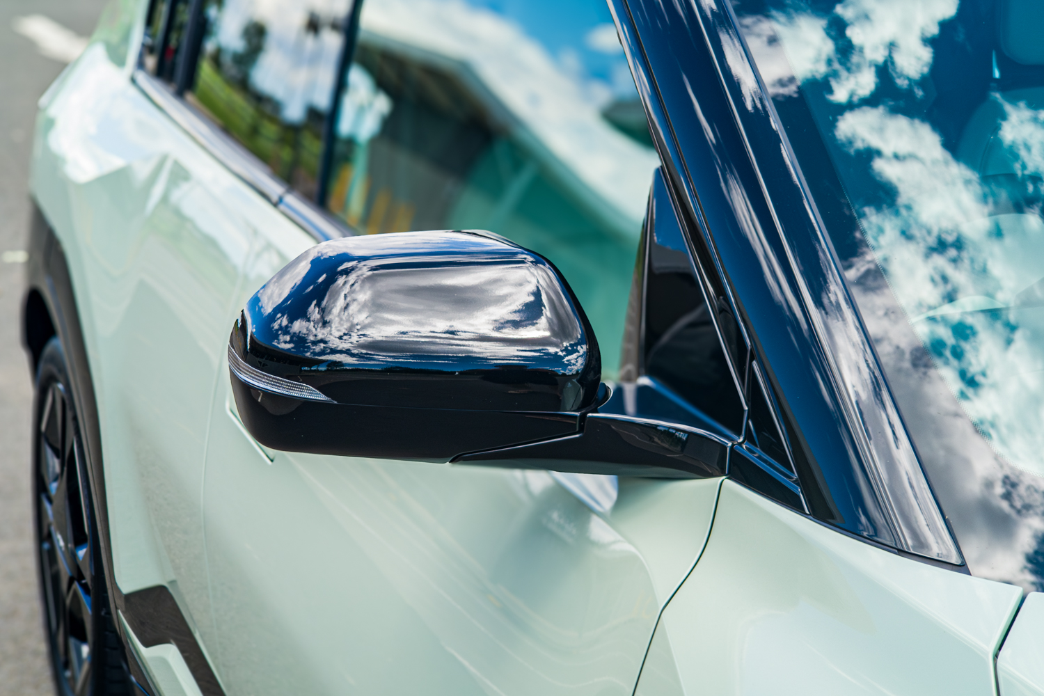 Side mirror close-up on the 2026 Kia EV3 GT-Line with black gloss cap