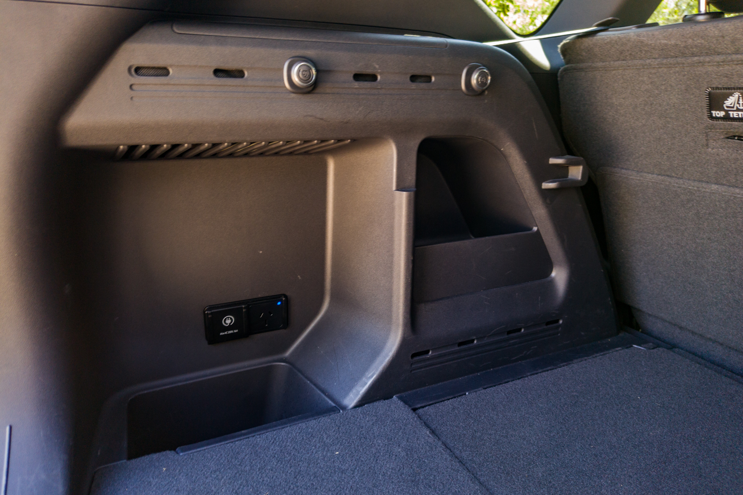 Side storage cubby and speaker in the Kia EV5 GT-Line boot