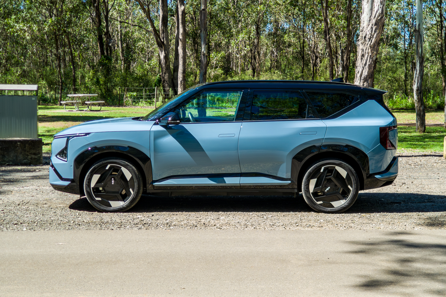 Passenger-side profile of the blue Kia EV5 GT-Line electric SUV