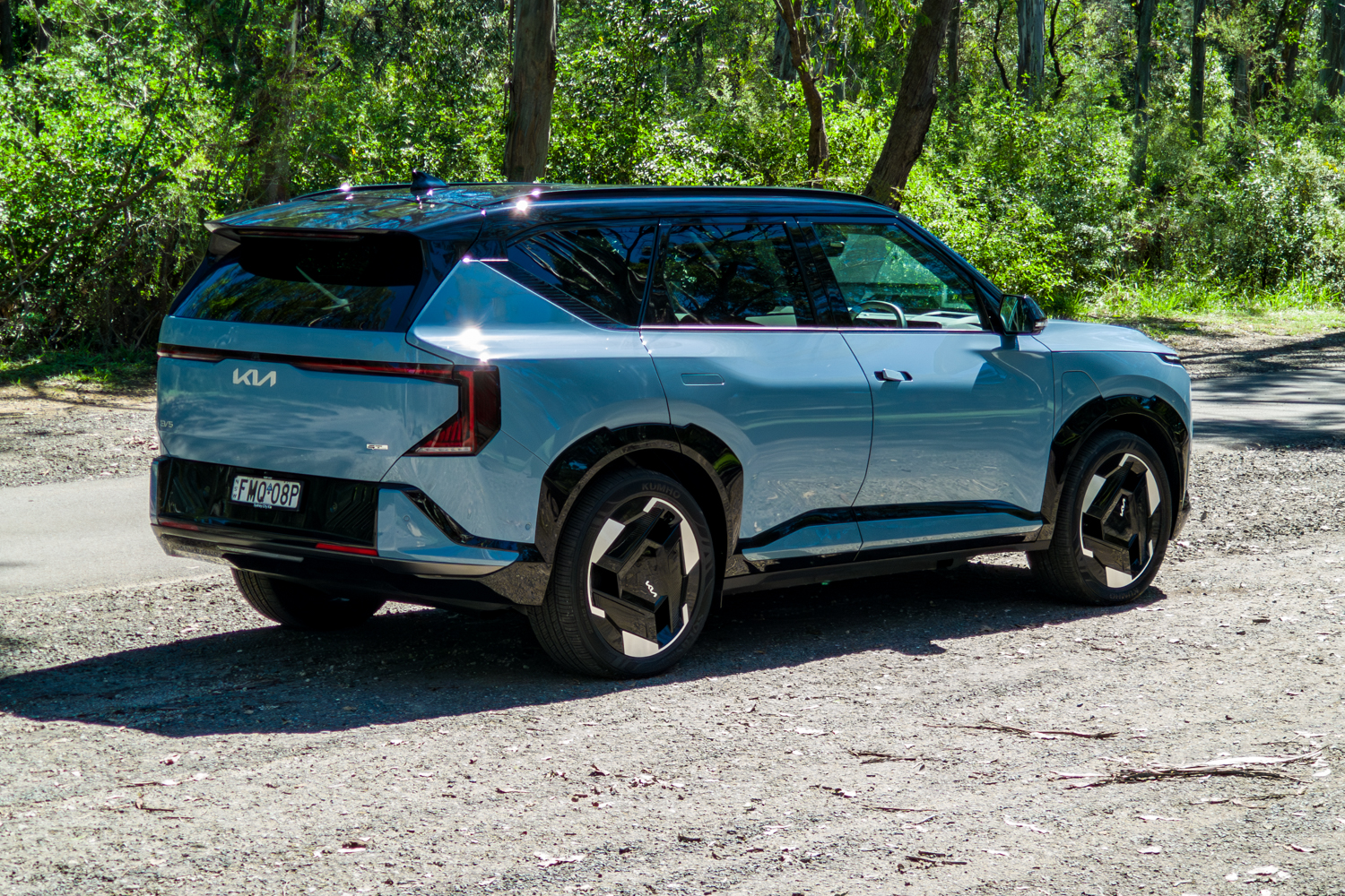 Rear three-quarter of the blue Kia EV5 GT-Line from the driver's side