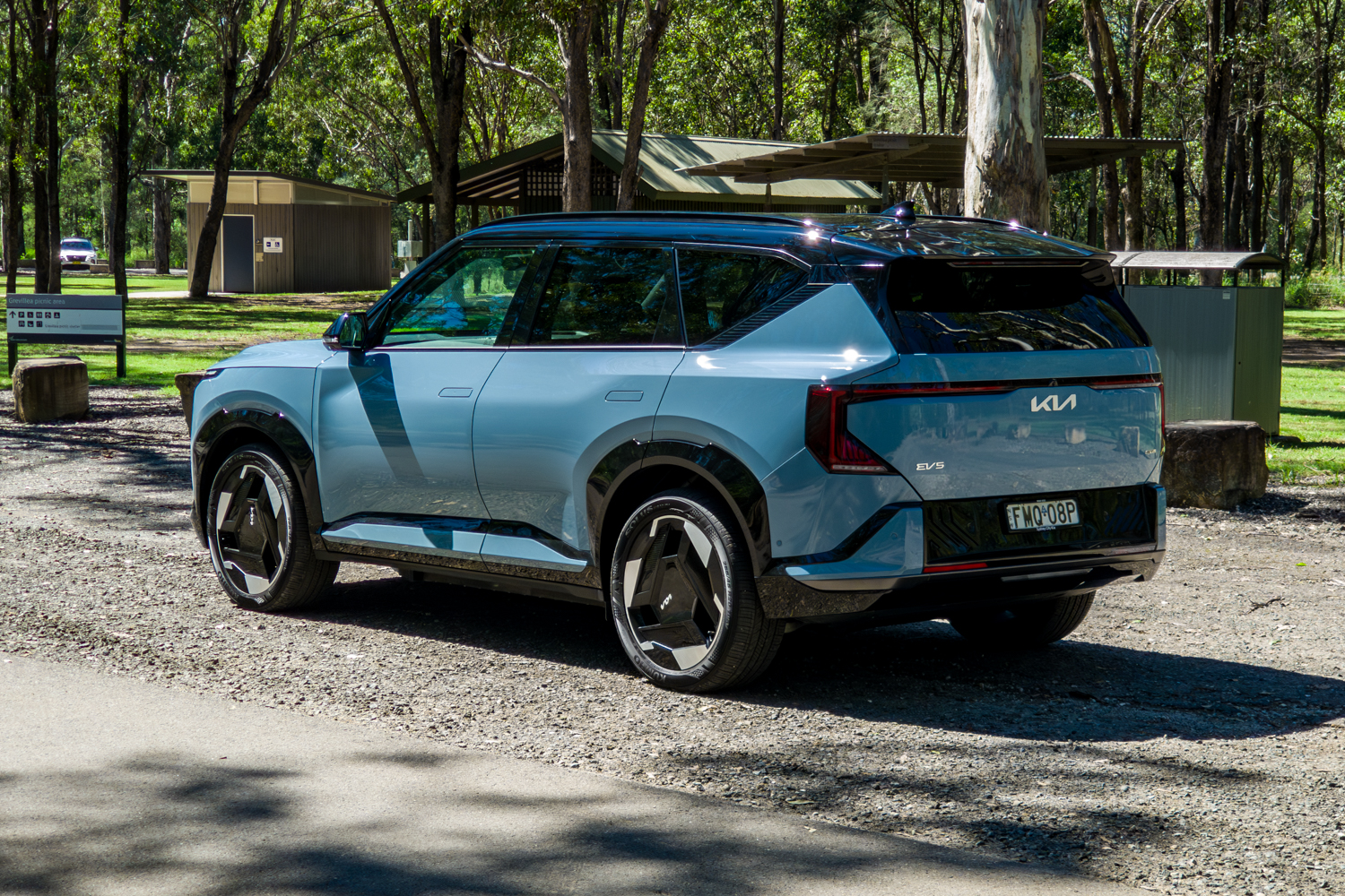 Rear three-quarter of the blue Kia EV5 GT-Line from the passenger side