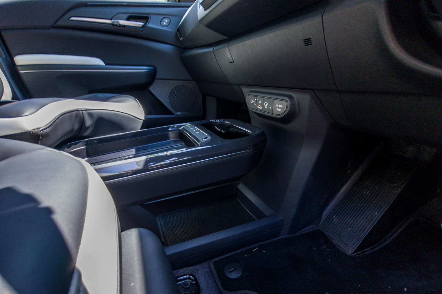 Low-angle view of the Kia EV5 GT-Line centre console and two-tone front seats