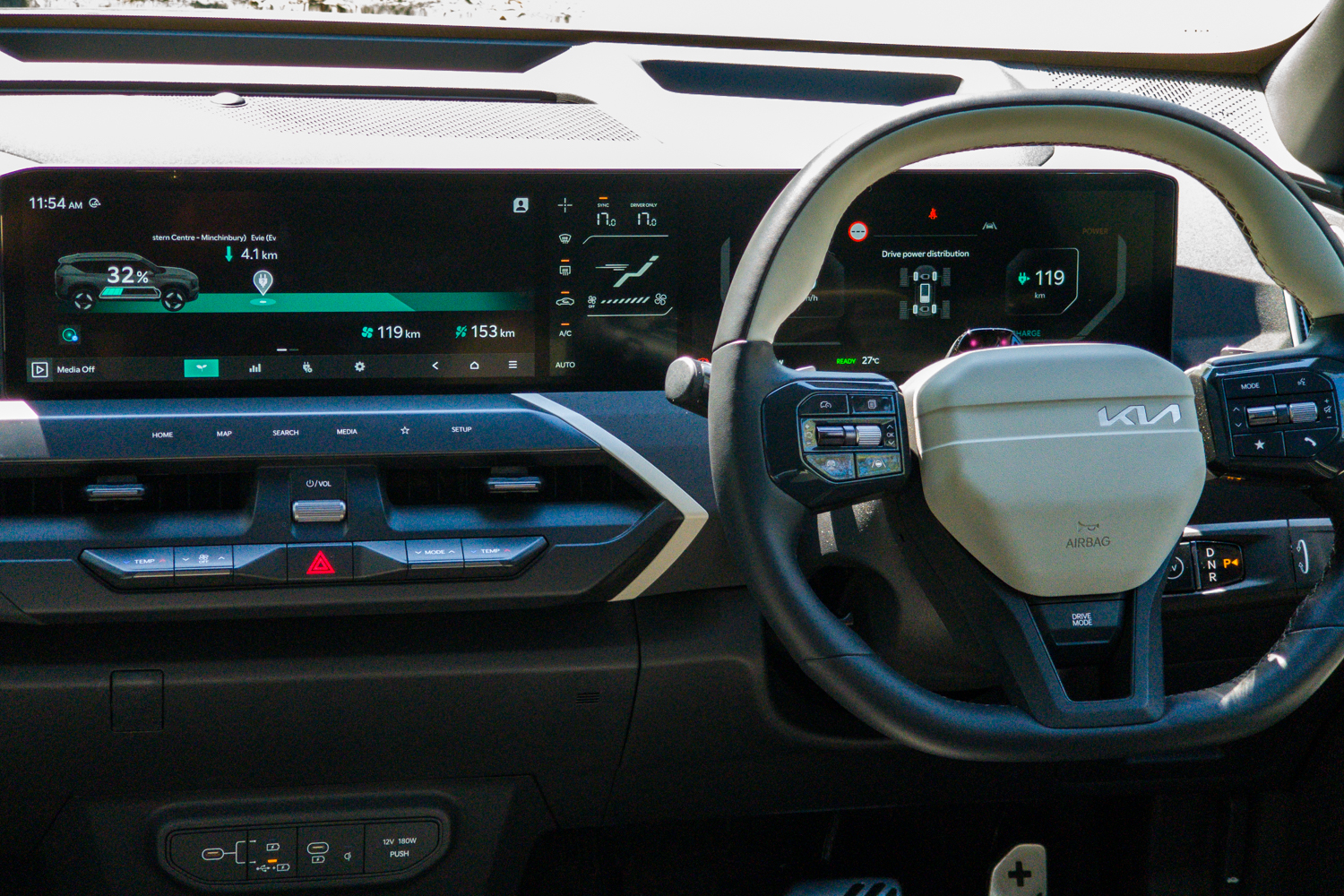 Driver's view of the Kia EV5 GT-Line dashboard with twin 12.3-inch displays and steering wheel