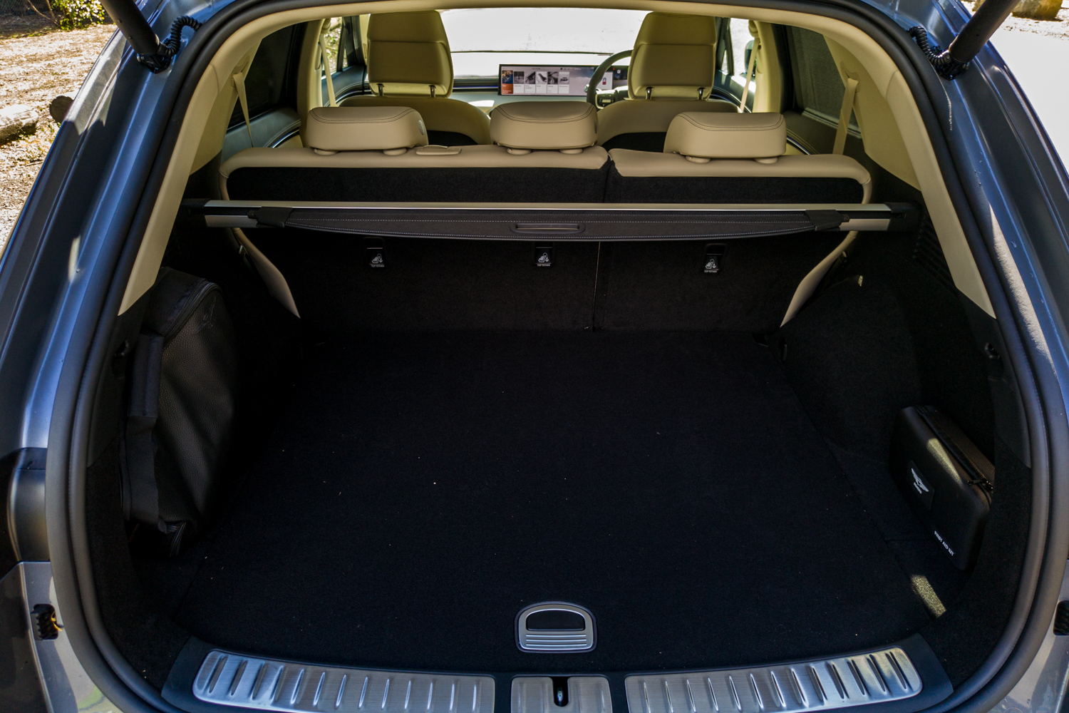 Open boot of the 2026 Genesis GV70 2.5T Advanced showing the 542-litre cargo area, retractable blind and tie-down net