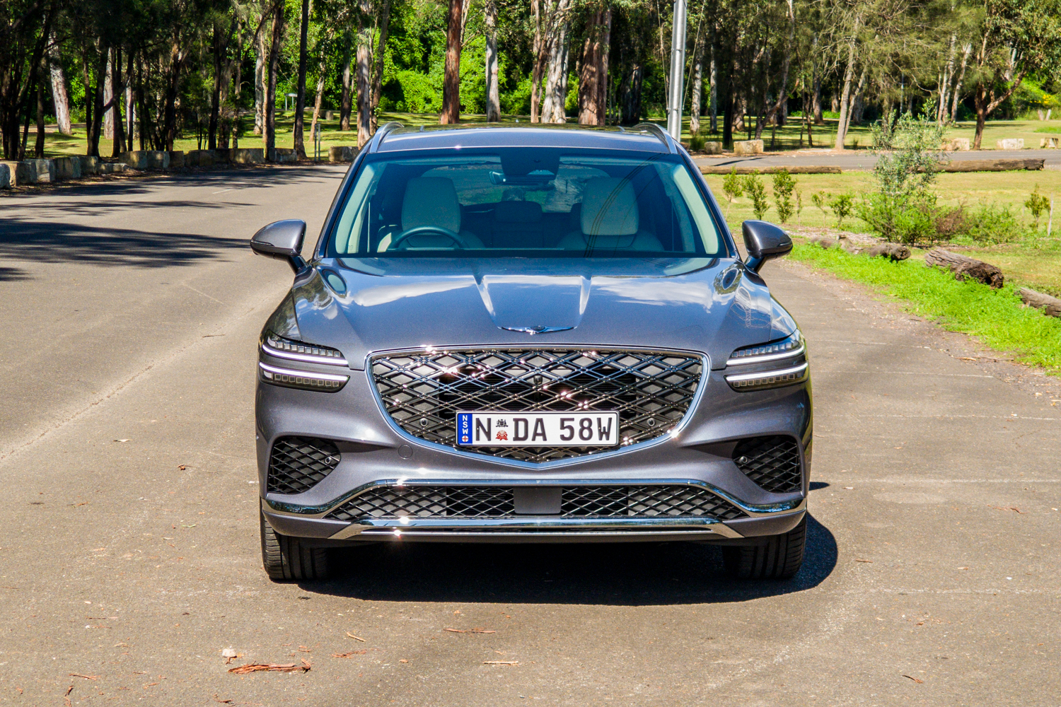 Straight-on front view of the 2026 Genesis GV70 2.5T Advanced showing the G-Matrix grille and two-line headlights