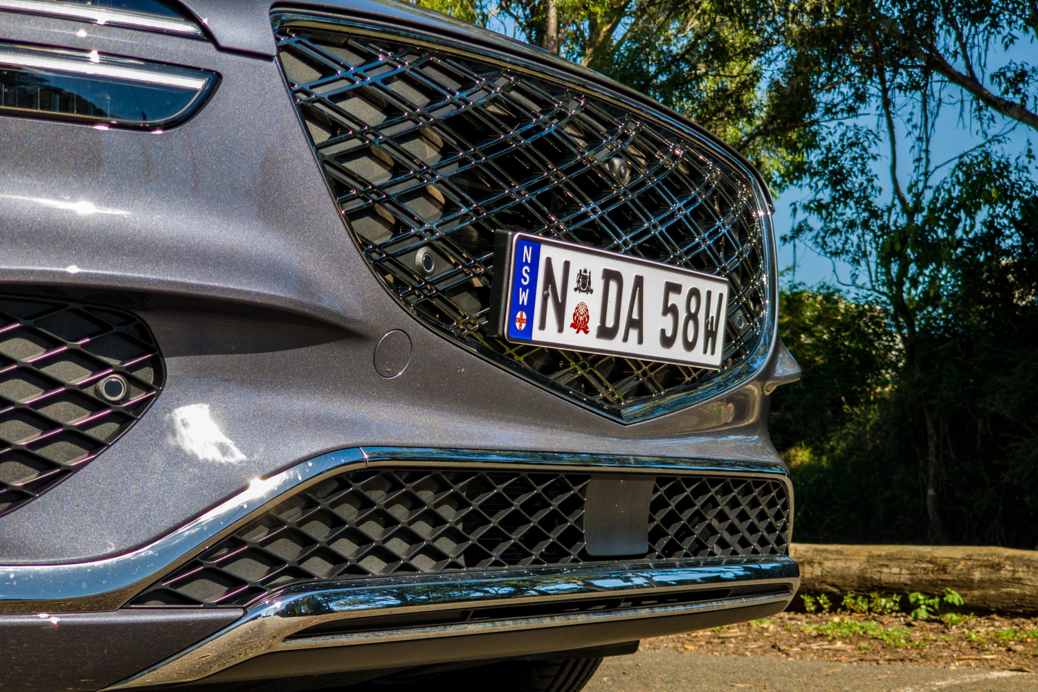 Close-up of the 2026 Genesis GV70 2.5T Advanced chrome double-mesh G-Matrix grille and front camera