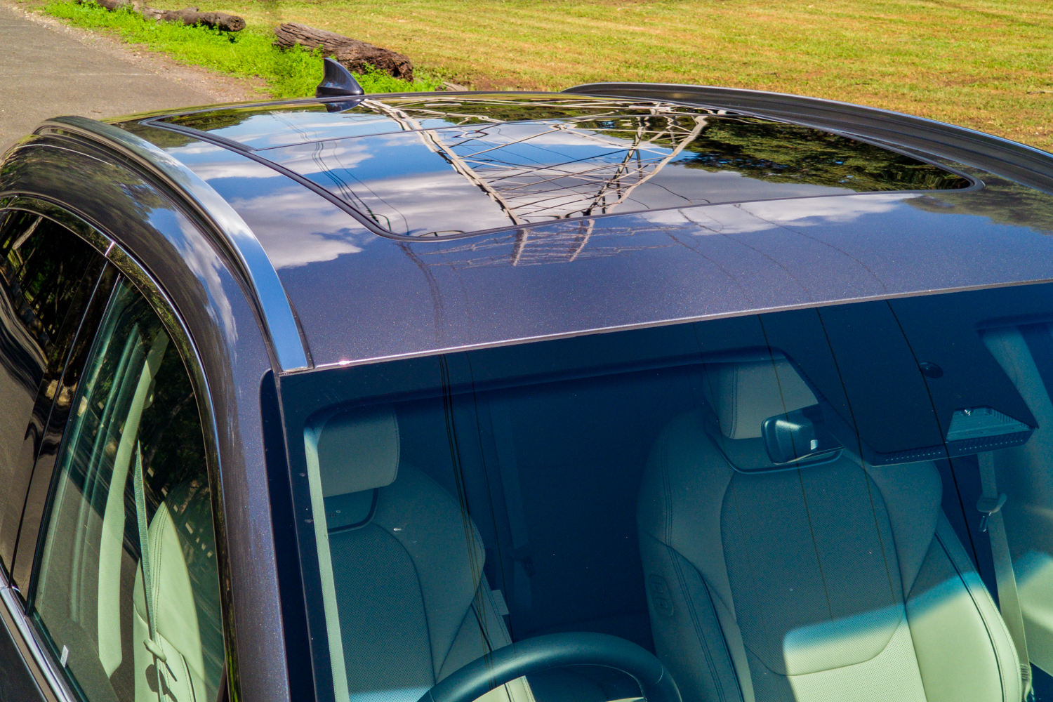 Top-down view of the 2026 Genesis GV70 2.5T Advanced roof showing the dual-panel panoramic sunroof and roof rails