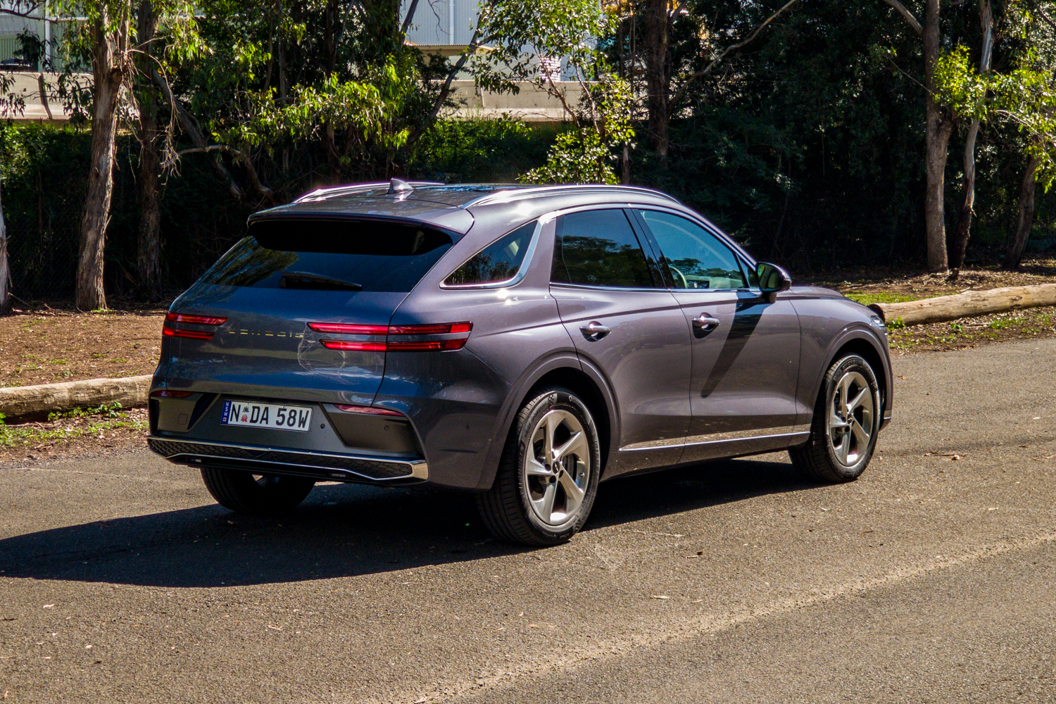 Driver's-side rear three-quarter of the 2026 Genesis GV70 2.5T Advanced showing the two-line tail lights