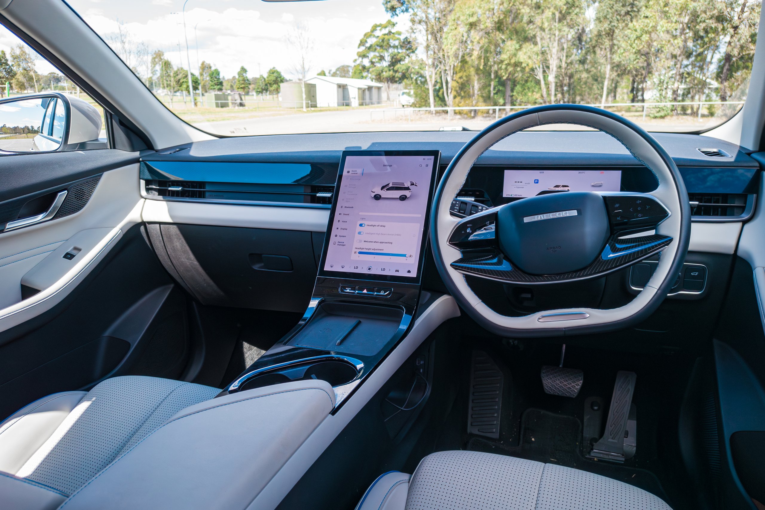Dashboard and floating centre console of the 2026 Jaecoo J5 EV Summit with the portrait screen and steering wheel