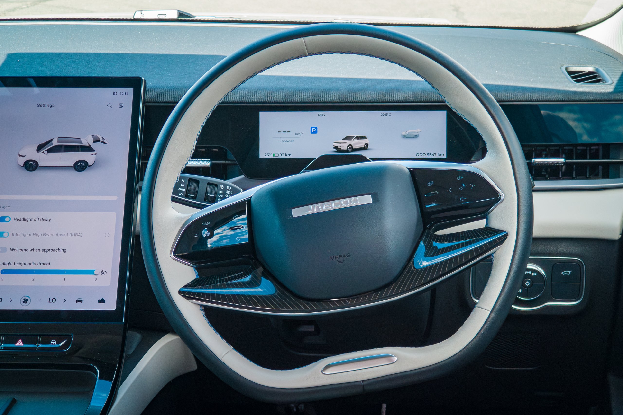 Close-up of the two-spoke steering wheel in the 2026 Jaecoo J5 EV Summit with the driver display behind