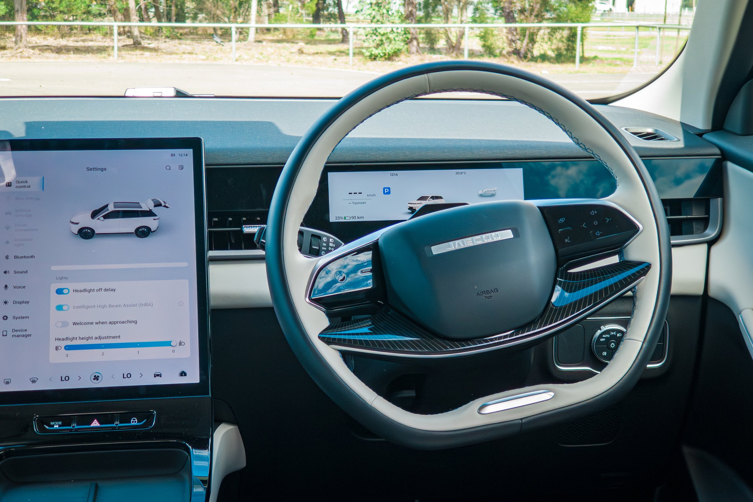 Two-spoke steering wheel and digital driver display of the 2026 Jaecoo J5 EV Summit from the driver's seat