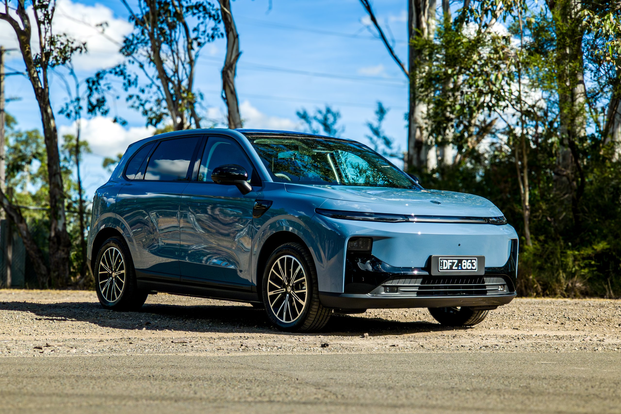 2026 Leapmotor B10 in steel blue, front-left three-quarter view showing LED strip and alloy wheels