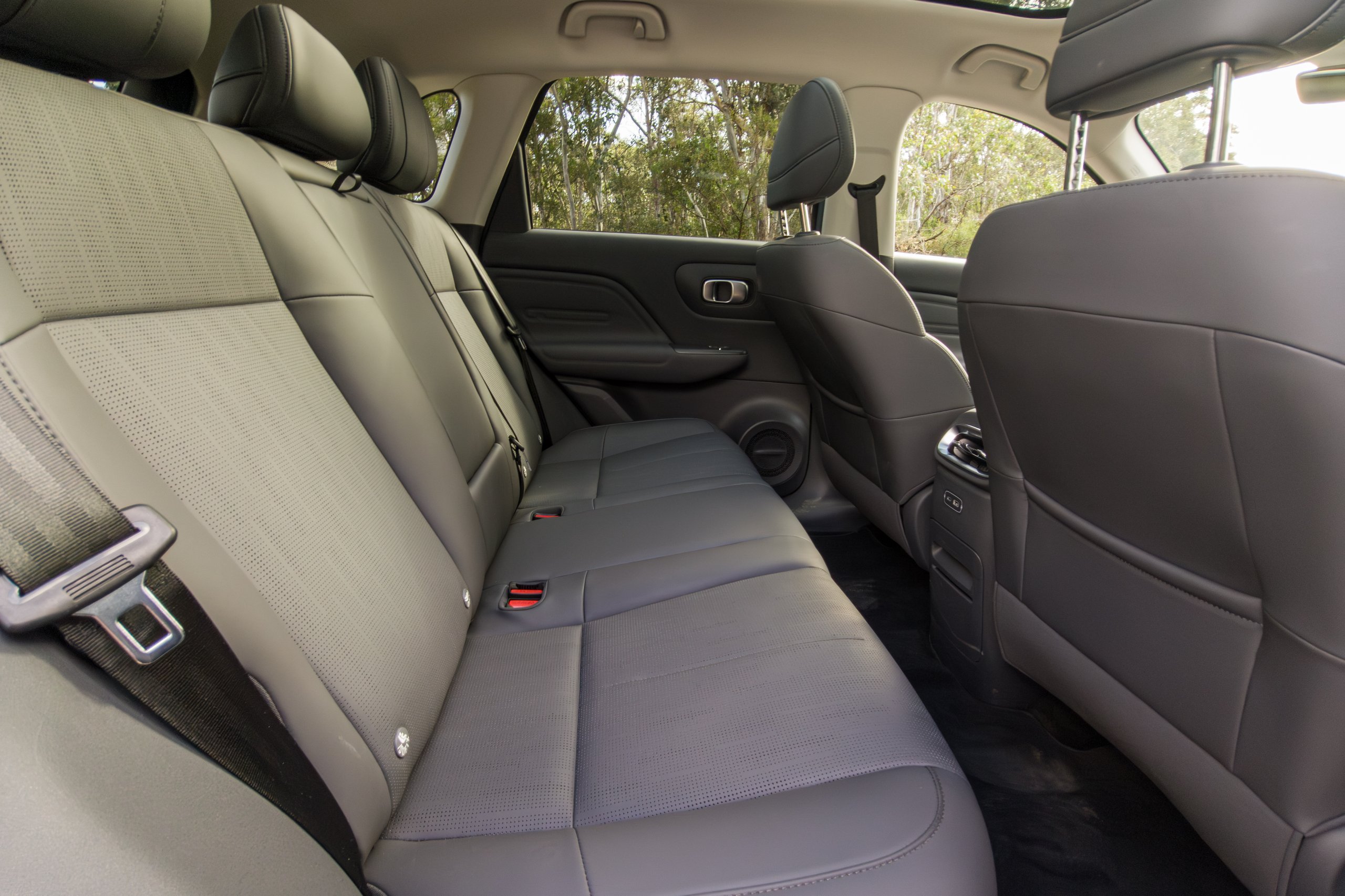 2026 Leapmotor B10 rear three-seat bench in grey perforated TechnoLeather with headrests and seatbelts and door trim