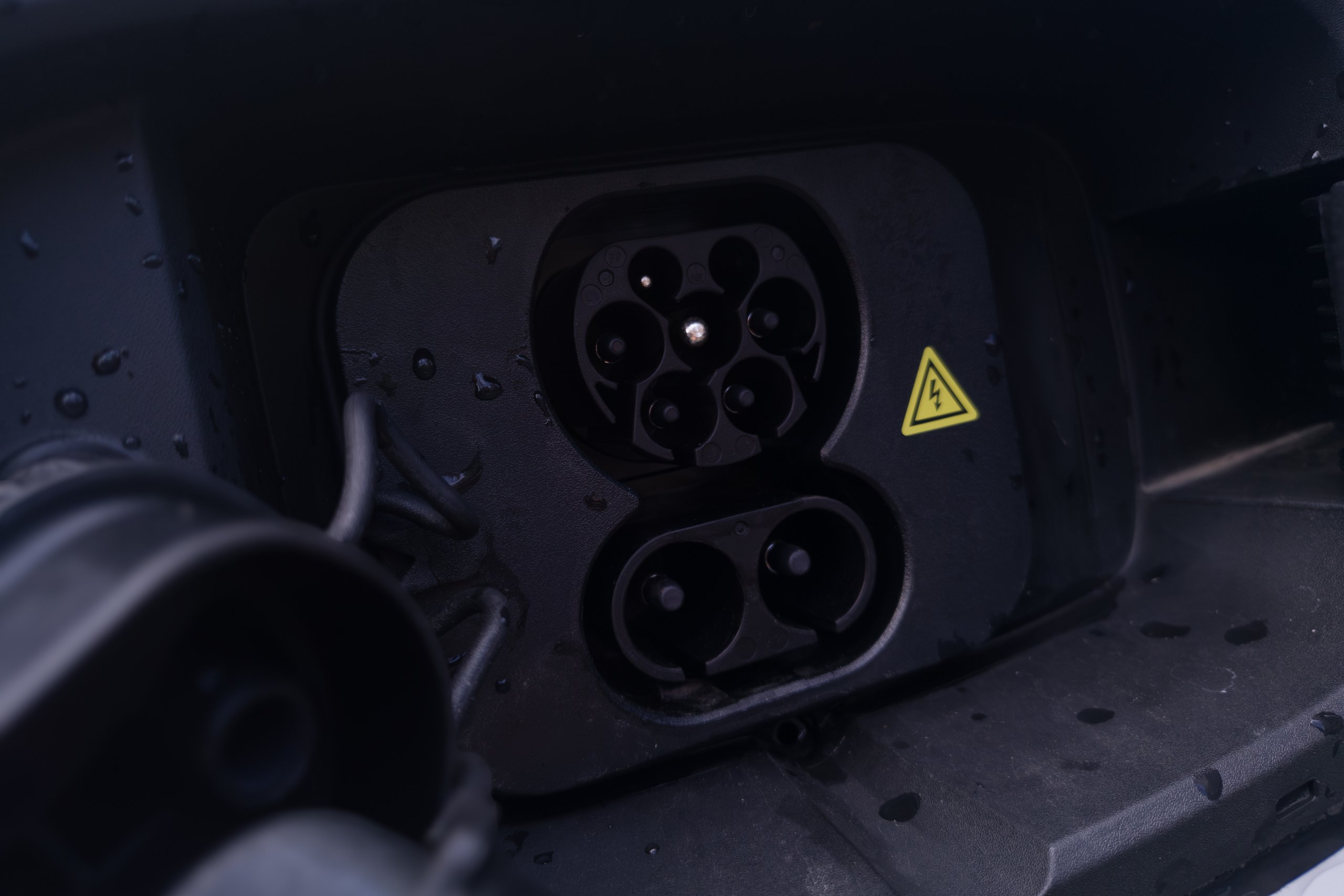 Open charge flap on the 2026 Mazda 6e GT showing the CCS2 combined AC and DC socket