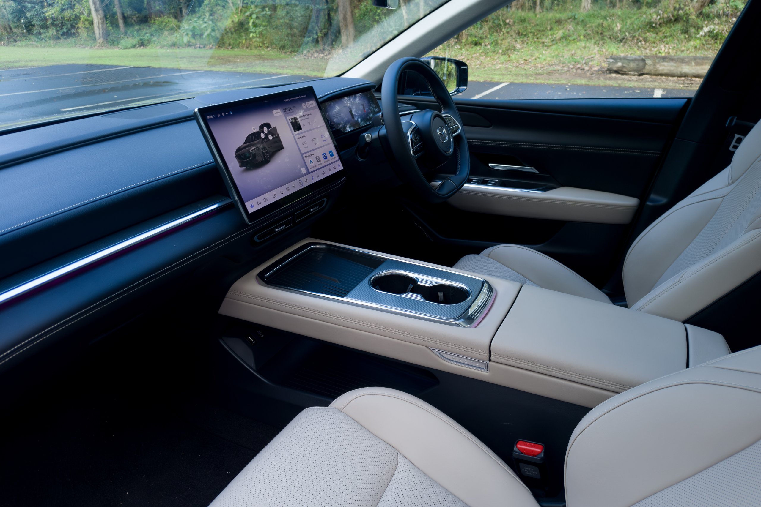 Beige and black interior of the 2026 Mazda 6e GT viewed from the passenger side