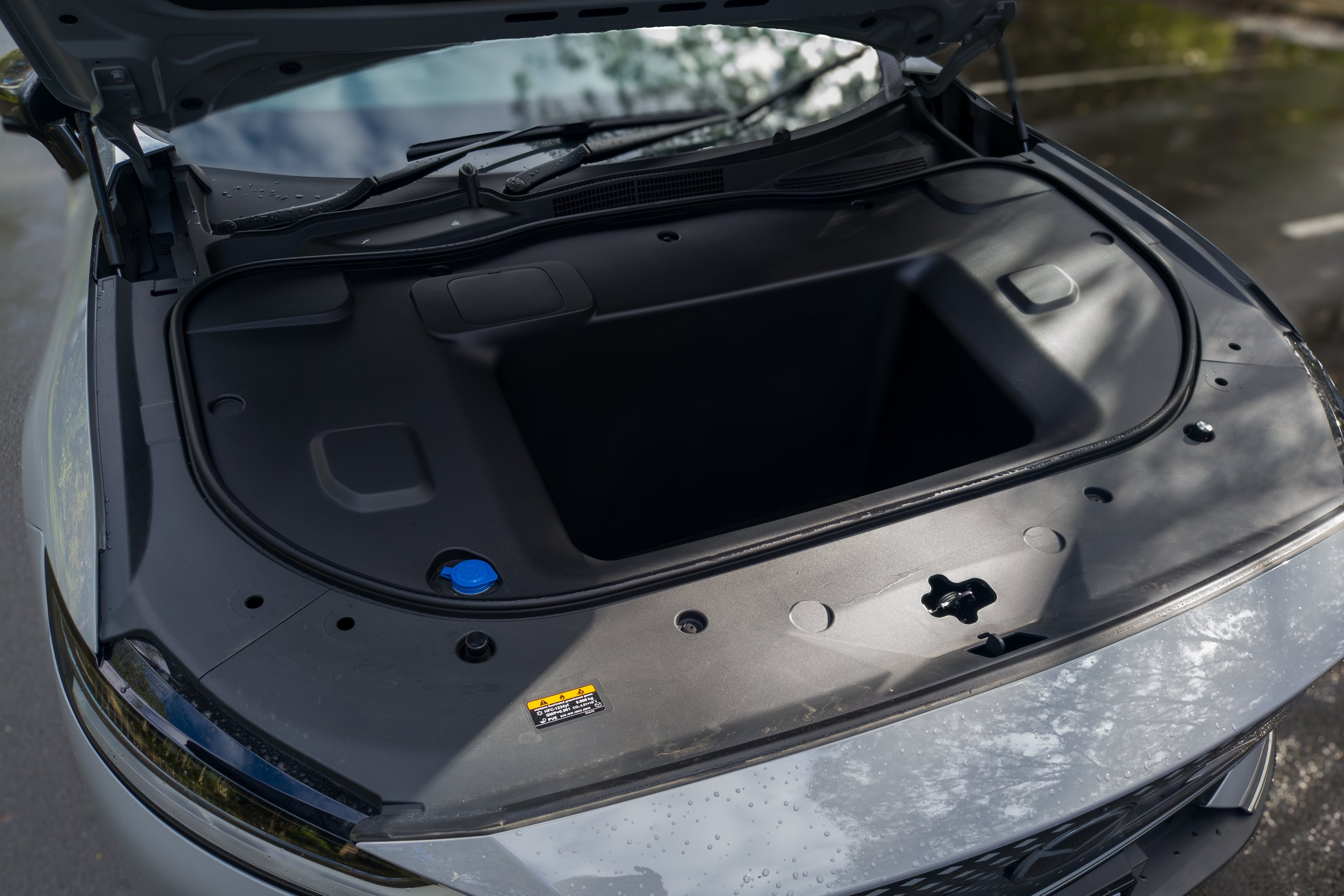 Open bonnet of the 2026 Mazda 6e GT revealing the front boot storage compartment