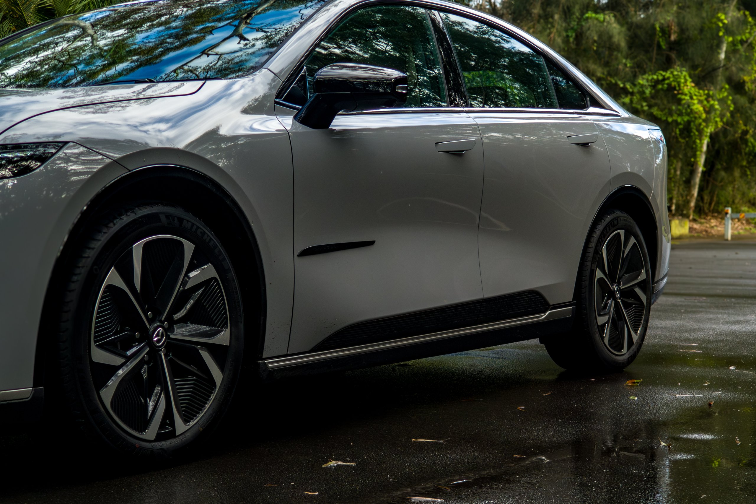 Lower side profile of the 2026 Mazda 6e GT showing aero alloy wheels and Michelin tyres