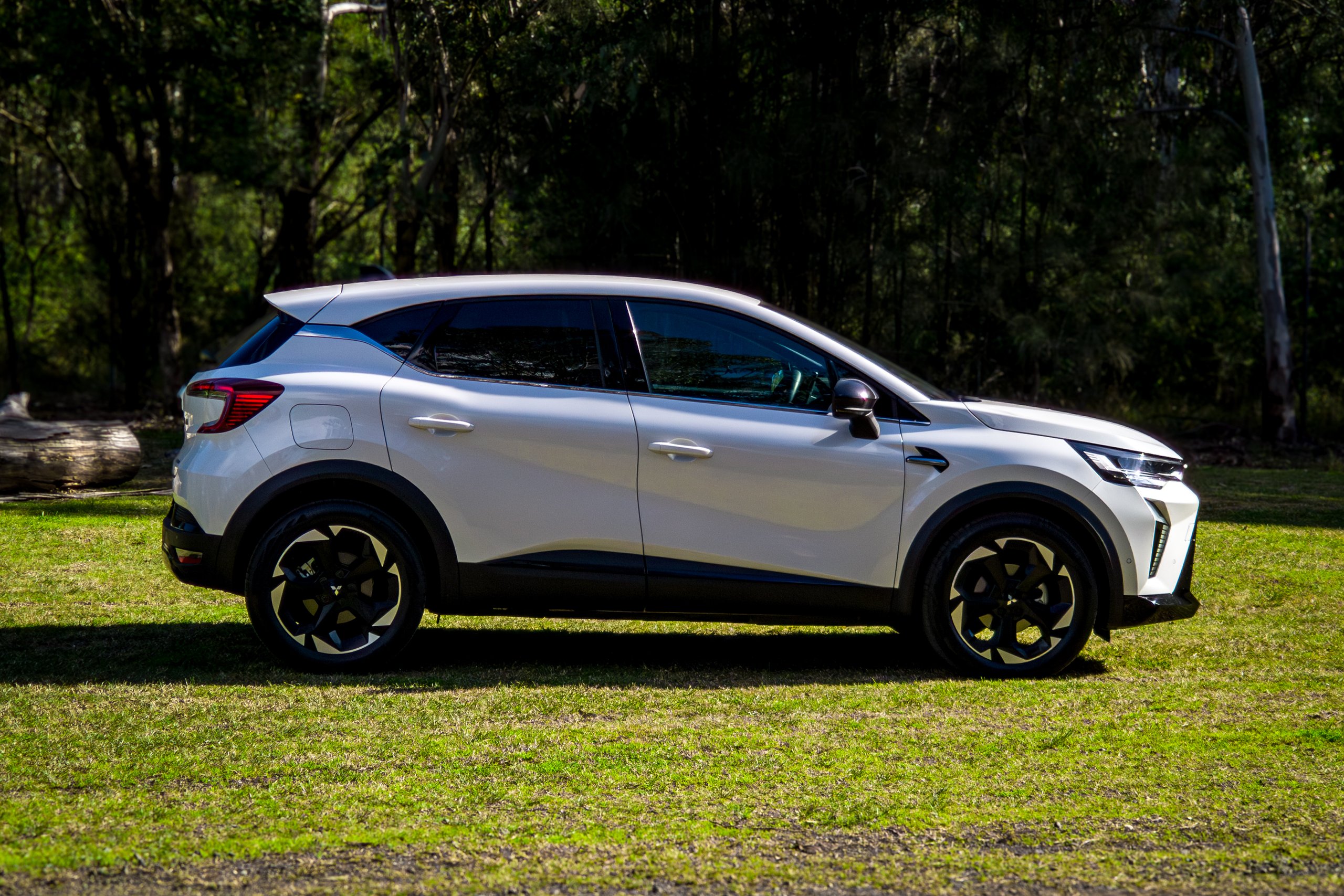 Crystal White 2026 Mitsubishi ASX Aspire driver's side profile parked on grass in bushland