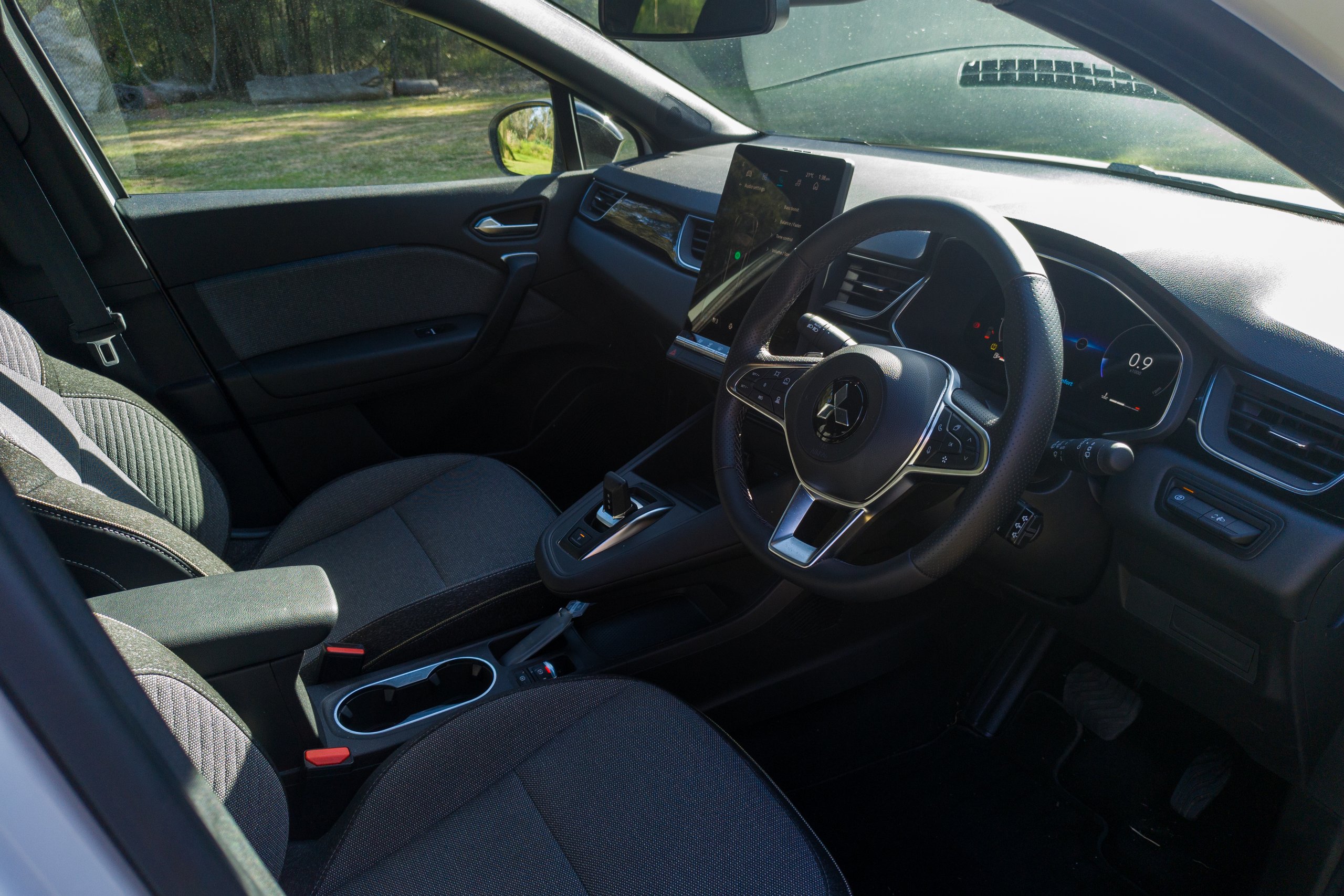 Front cabin of the 2026 Mitsubishi ASX Aspire seen from the driver's door opening