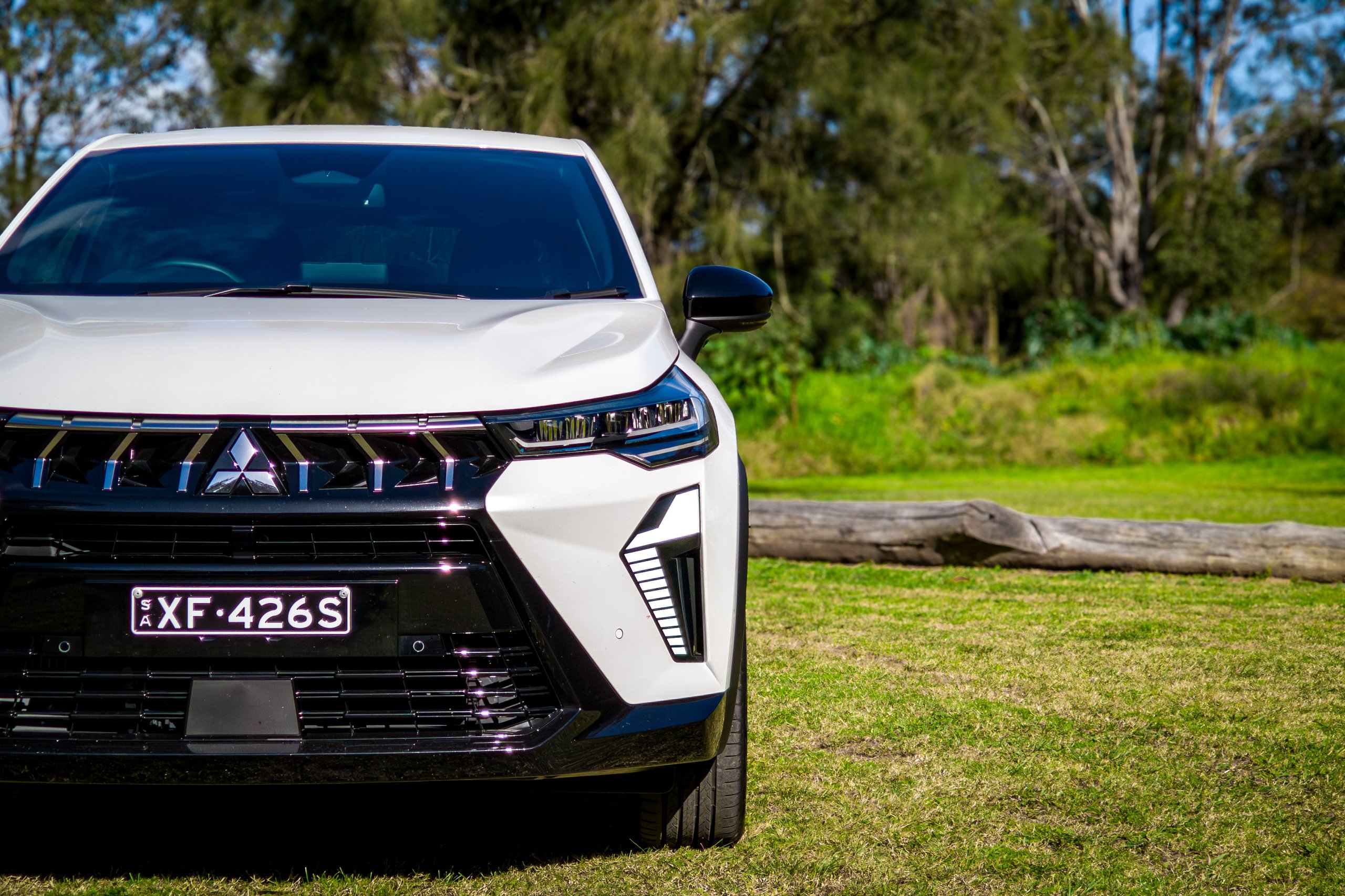 Close-up of the 2026 Mitsubishi ASX Aspire bonnet, grille badge and LED lighting signature