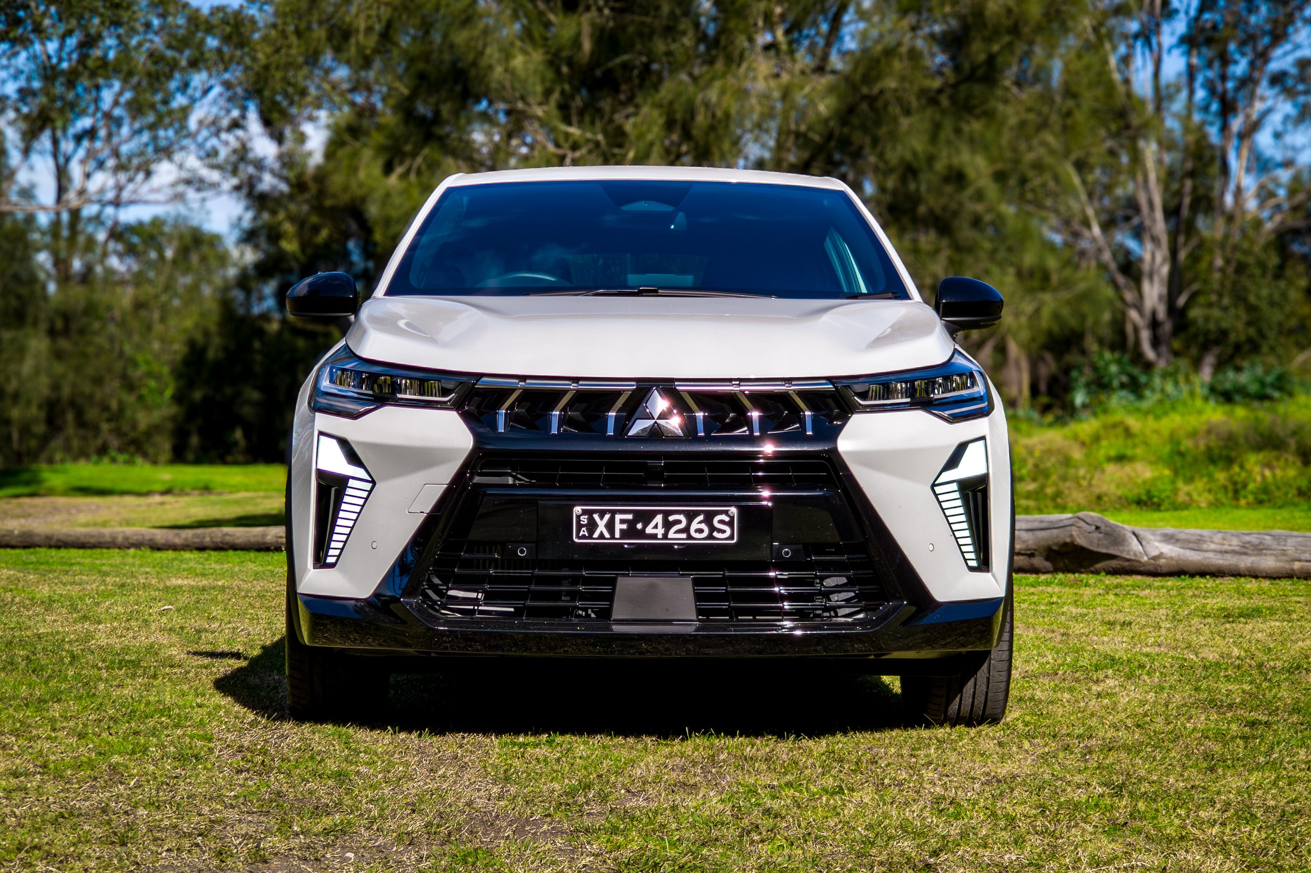 Crystal White 2026 Mitsubishi ASX Aspire straight-on front view showing the full lighting signature