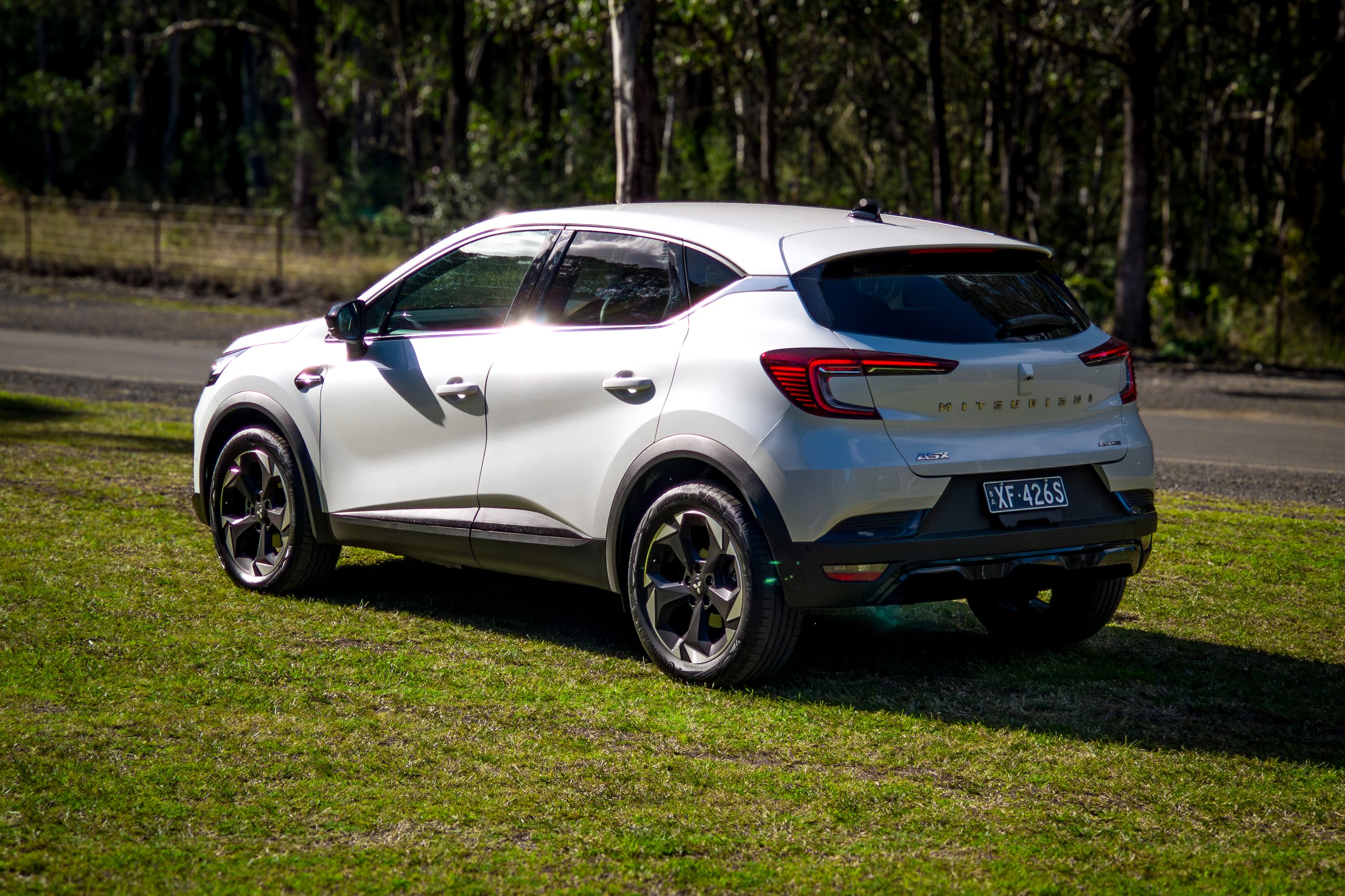 Crystal White 2026 Mitsubishi ASX Aspire rear quarter view showing tail lights and rear bumper detail