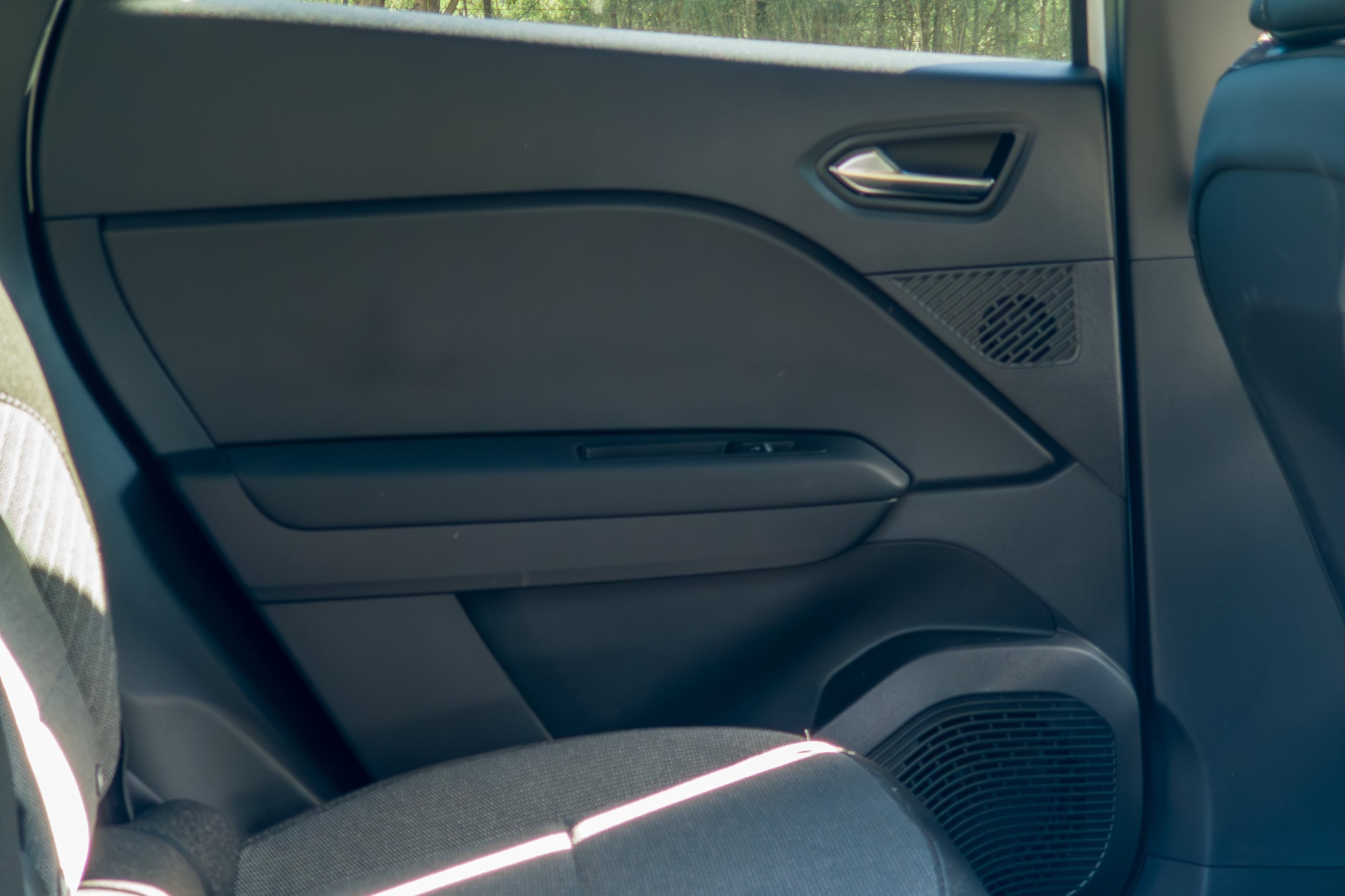 Rear door card of the 2026 Mitsubishi ASX Aspire showing the handle, speaker and bottle storage