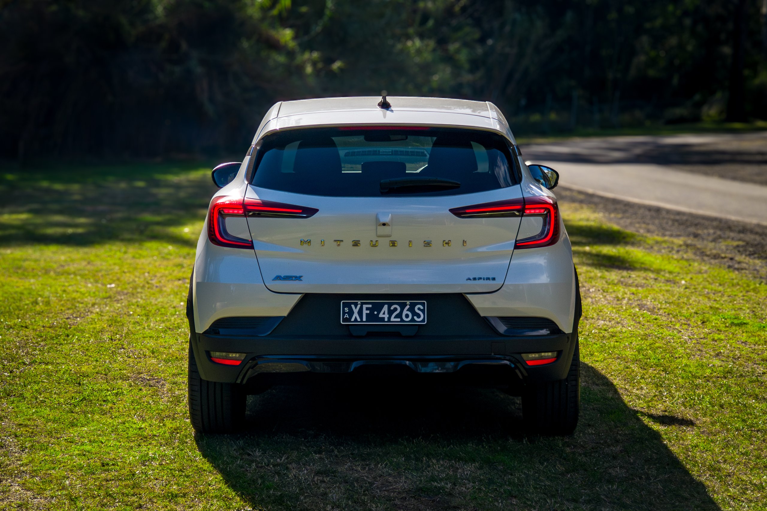 Rear view of the Crystal White 2026 Mitsubishi ASX Aspire showing the tailgate, spoiler and tail lights